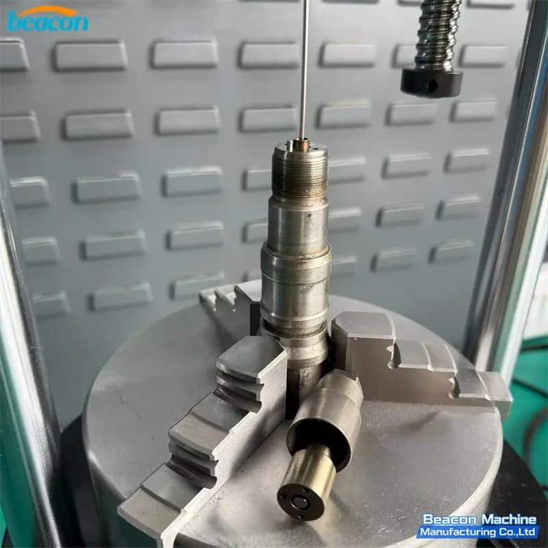Close-up of G6-87 injector stroke tester pneumatic chuck securely holding a diesel injector.