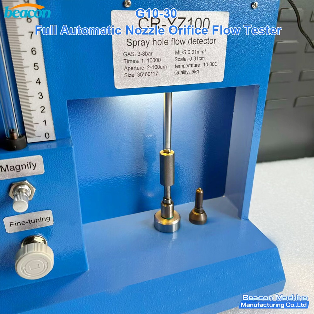 Close-up of nozzle spray hole flow detector testing area with precision clamping.