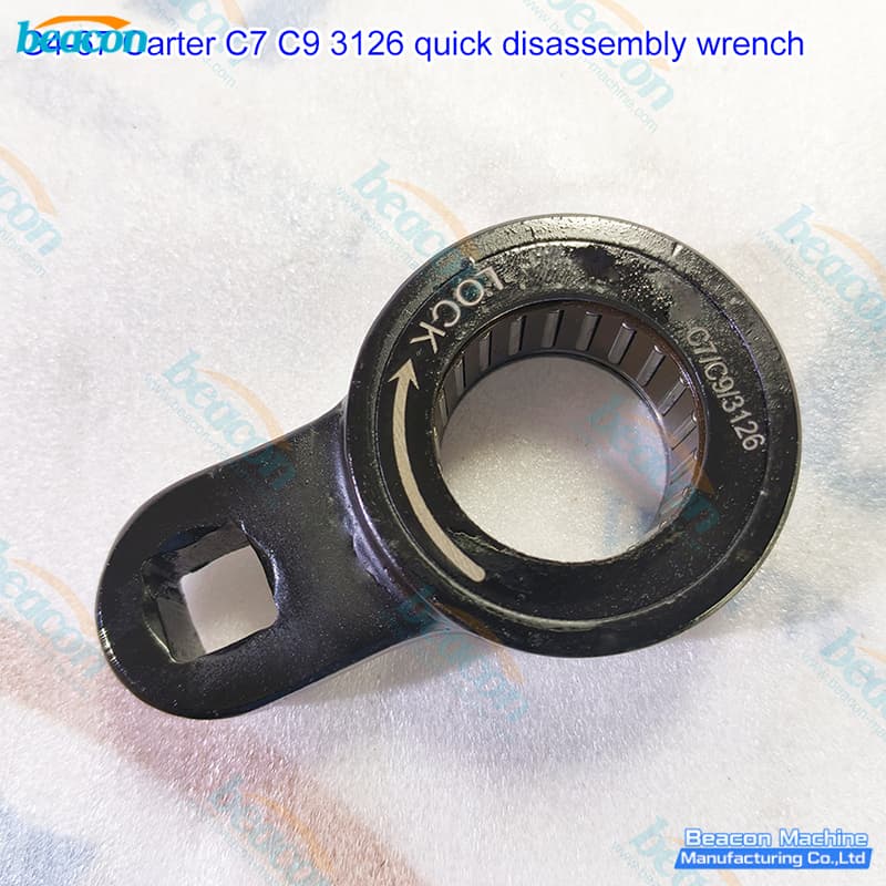 Close-up of G4-67 HEUI injector tool showing laser-etched LOCK directional markings